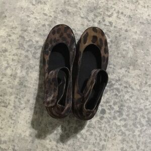 Leopard Print platform’s Velcro strap around ankle